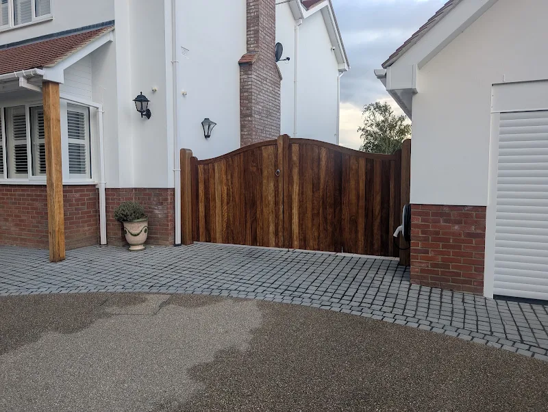 Hand-finished timber double gate stained and varnished